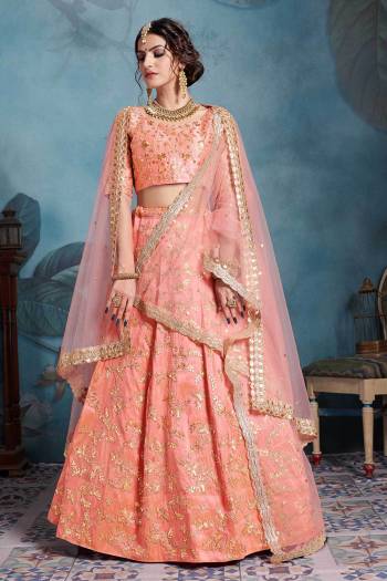 For The Season's Trending Bride Here Is a Very Beautiful Heavy Designer Lehenga Choli In All Over Peach Color. Its Blouse And Lehenga Are Fabricated On Art Silk Paired With Net Fabricated Dupatta. It Is Beautified With Heavy Embroidery Over The Lehenga Choli And Also Its Both The Dupattas. 