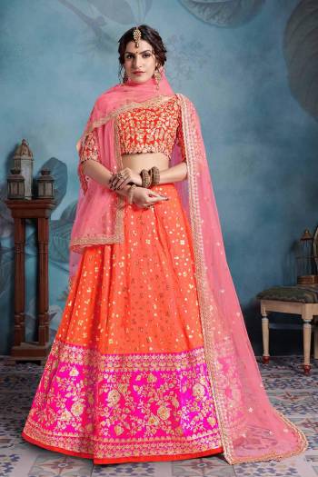 Catch all the Limelight Wearing This Heavy Designer Lehenga Choli In Orange Color Paired With Two Dupattas In Light Pink Color. This Pretty Heavy Embroidered Lehenga Choli Is Art Silk Based Paired With Net Fabricated Dupatta. 