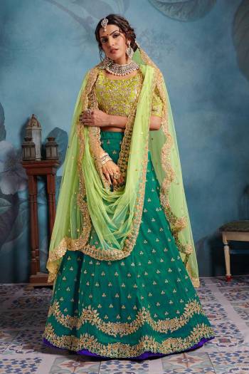 Look Pretty In This Shades Of Green With This Very Beautiful Heavy Designer Lehenga Choli In Light Green Colored Blouse Paired With Teal Green Colored Lehenga And Light Green Colored Two Dupatta. Its Blouse And Lehenga Are Fabricated on Art Silk Paired With Net Fabricated Dupatta. Buy Now.