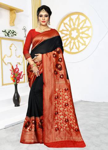 Grab This Rich And Elegant Looking Silk Based Designer Saree In Black Color Paired With Red Colored Blouse. This Saree And Blouse are Fabricated On Banarasi Art Silk Beautified With Weave Over Its Attractive Broad Border. 