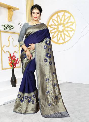 Celebrate This Festive Season In Proper Traditional Look Wearing This Silk Based Saree In Royal Blue Color Paired With Contrasting Grey Colored Blouse. This Saree And Blouse are Fabricated On Banarasi Art Silk Beautified With Bold Motif Weave. 