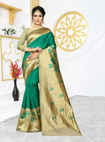 Celebrate This Festive Season In Proper Traditional Look Wearing This Silk Based Saree In Green Color Paired With Contrasting Golden Colored Blouse. This Saree And Blouse are Fabricated On Banarasi Art Silk Beautified With Bold Motif Weave. 