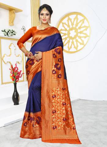 Grab This Rich And Elegant Looking Silk Based Designer Saree In Royal Blue Color Paired With Orange Colored Blouse. This Saree And Blouse are Fabricated On Banarasi Art Silk Beautified With Weave Over Its Attractive Broad Border. 