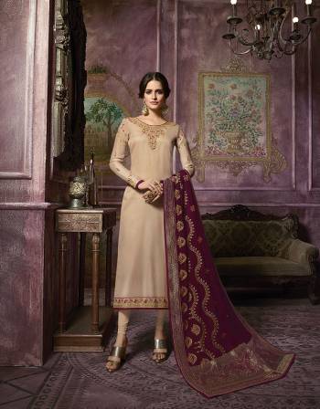 Flaunt Your Rich And Elegant Taste Wearing This Designer Suit With Heavy Dupatta Concept. Its Top and Bottom are In Beige Color Paired With Maroon Colored Dupatta. Top Is Fabricated On Satin Georgette Paired With Santoon Bottom and Georgette Dupatta With  Banarasi Art Silk Broad Border.  