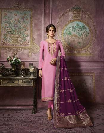 Look Pretty In This Designer Straight Suit In Pink Colored Top And Bottom Paired With Contrasting Purple Colored Dupatta. Its Top IS Satin Georgette Based Paired With Santoon Bottom and Georgette Dupatta With Banarasi Art Silk Border. Its Top And Dupatta Are Beautified With Heavy Embroidery Which Gives An Attractive Look.