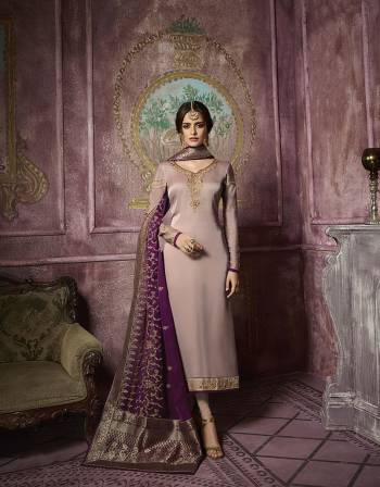 New And Unique Shade In Purple IS Here With This Heavy designer Straight Cut Suit In Mauve Color Paired With Purple Colored Dupatta. Its Top IS Satin Georgette Based Paired With Santoon Bottom And Georgette Dupatta. The Highlight Of The Suit Is Its Lovely Dupatta With Banarasi Art Silk Broad Border. 