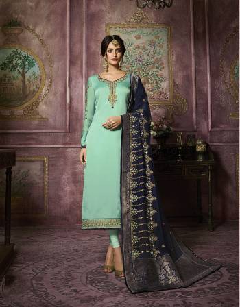 Look Pretty In This Designer Straight Suit In Aqua Blue Colored Top And Bottom Paired With Contrasting Navy Blue Colored Dupatta. Its Top IS Satin Georgette Based Paired With Santoon Bottom and Georgette Dupatta With Banarasi Art Silk Border. Its Top And Dupatta Are Beautified With Heavy Embroidery Which Gives An Attractive Look.