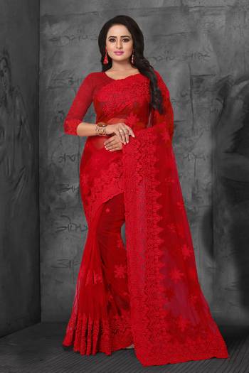 Adorn The Angelic Look In This Heavy Designer Tone To Tone Embroidered Saree In Red Color. This Saree And Blouse Are Fabricated On Net Highlighted With Tone To Tone Ceramic Stone Work All Over It. 