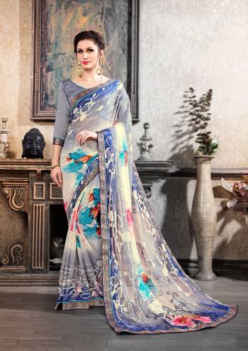 Pretty Simple and Elegant Saree IS Here For Your Semi-Casuals. This Pretty Saree Is Fabricated On Chiffon Brasso Paired With Art Silk Fabricated Blouse. It Is Beautified With Prints All over and Also It Is Light Weight And Easy To Carry All Day long. 