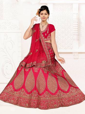 Here Is A Very Beautiful Heavy Designer Bridal Lehenga Choli In All Over Dark Pink. Its Blouse And Lehenga Are Fabricated On Satin Silk Paired With Net Fabricated Dupatta. It Is Beautified With Heavy Embroidery Giving It An Attractive Look. 