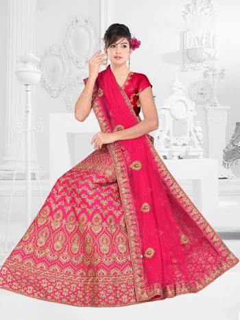 Here Is A Very Beautiful Heavy Designer Bridal Lehenga Choli In All Over Dark Pink. Its Blouse And Lehenga Are Fabricated On Satin Silk Paired With Net Fabricated Dupatta. It Is Beautified With Heavy Embroidery Giving It An Attractive Look. 