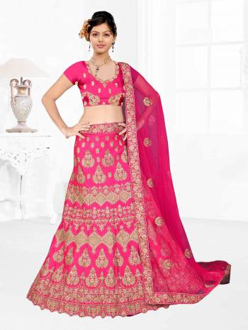 Here Is A Very Beautiful Heavy Designer Bridal Lehenga Choli In All Over Dark Pink. Its Blouse And Lehenga Are Fabricated On Satin Silk Paired With Net Fabricated Dupatta. It Is Beautified With Heavy Embroidery Giving It An Attractive Look. 