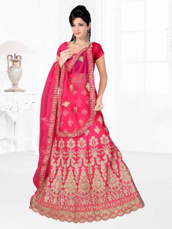 Here Is A Very Beautiful Heavy Designer Bridal Lehenga Choli In All Over Dark Pink. Its Blouse And Lehenga Are Fabricated On Satin Silk Paired With Net Fabricated Dupatta. It Is Beautified With Heavy Embroidery Giving It An Attractive Look. 