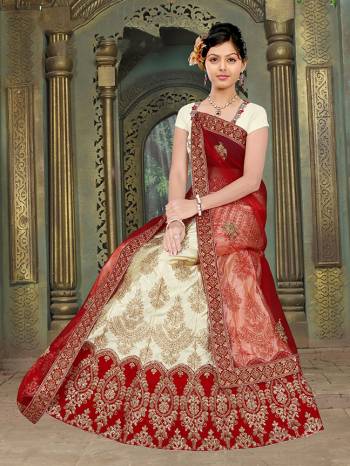 Flaunt Your Rich And Elegant Taste With Some Subtle Color Pallet In Your Bridal Wear. Grab This Heavy Designer Lehenga Choli In Cream Color Paired With Red Colored Dupatta. Its Blouse Are Lehenga are Satin Silk Based Paired With Net Fabricated Dupatta. 