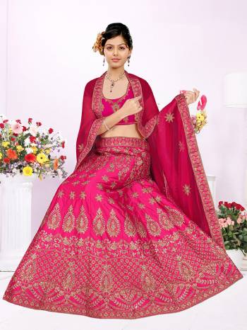 Here Is A Very Beautiful Heavy Designer Bridal Lehenga Choli In All Over Dark Pink. Its Blouse And Lehenga Are Fabricated On Satin Silk Paired With Net Fabricated Dupatta. It Is Beautified With Heavy Embroidery Giving It An Attractive Look. 