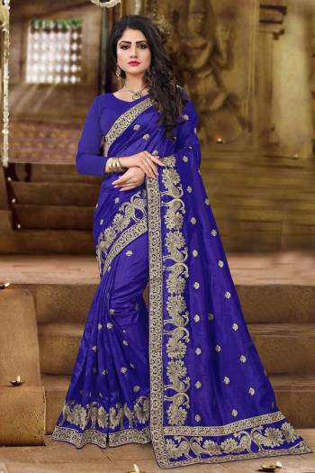 Get Ready For The Upcoming Festive And Wedding Season With This Designer Saree In Navy Blue Color. This Saree And Blouse Are Fabricated On Art Silk Beautified with Jari Embroidery In Lovely Peacock Motifs. This Pretty Saree Is Light Weight And Easy To Carry All Day Long. 