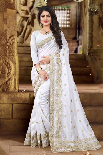 Get Ready For The Upcoming Festive And Wedding Season With This Designer Saree In White Color. This Saree And Blouse Are Fabricated On Art Silk Beautified with Jari Embroidery In Lovely Peacock Motifs. This Pretty Saree Is Light Weight And Easy To Carry All Day Long. 