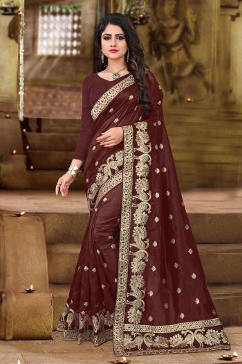 Get Ready For The Upcoming Festive And Wedding Season With This Designer Saree In Brown Color. This Saree And Blouse Are Fabricated On Art Silk Beautified with Jari Embroidery In Lovely Peacock Motifs. This Pretty Saree Is Light Weight And Easy To Carry All Day Long. 