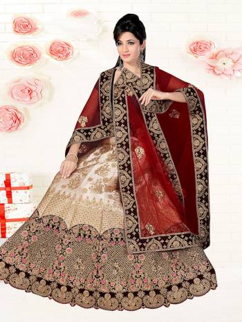 Go Colorful With This Heavy Designer Lehenga Choli For Your Bridal Wear In Black Colored Blouse Paired With Cream Colored Lehenga And Maroon Colored Dupatta. This Lehenga Choli IS Fabricated On Satin Silk Paired With Net Fabricated Dupatta. 