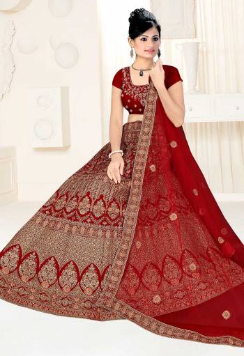 Here Is A Very Beautiful Heavy Designer Bridal Lehenga Choli In All Over Maroon Color. Its Blouse And Lehenga Are Fabricated On Satin Silk Paired With Net Fabricated Dupatta. It Is Beautified With Heavy Embroidery Giving It An Attractive Look. 