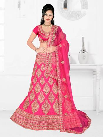 Here Is A Very Beautiful Heavy Designer Bridal Lehenga Choli In All Over Fuschia Pink. Its Blouse And Lehenga Are Fabricated On Satin Silk Paired With Net Fabricated Dupatta. It Is Beautified With Heavy Embroidery Giving It An Attractive Look. 