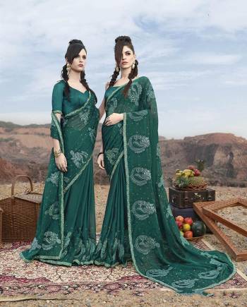 Here Is A Very Beautiful Designer Saree In New Shade With This Teal Green Color Paired With Contrasting Teal Green Colored Blouse. This Saree Is Georgette Based Paired With Art Silk Fabricated Blouse. Buy this Saree Now. 