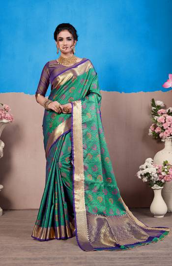 Rich And Elegant Looking Designer Silk Based Saree Is Here In Sea Green Color Paired With Violet Colored Blouse. This Saree And Blouse Are Fabricated On Nylon Art Silk Beautified Intricate Weave All Over It. Buy This Saree Now.