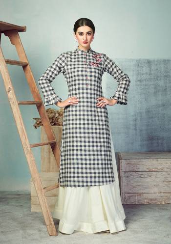 Another Very Beautiful Checks Printed Readymade Kurti Is Here In Black And White Color Paired With White Colored Bottom. Its Top Is Fabricated On Handloom Cotton Paired With Rayon Fabricated skirt. Buy Now.