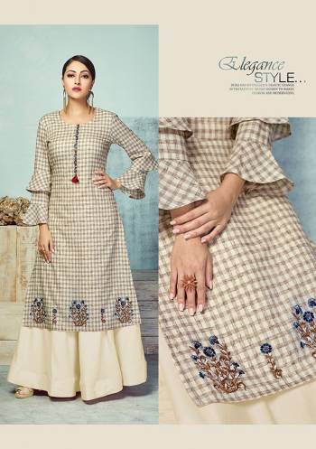 Flaunt Your Rich And Elegant Taste Wearing This Designer Readymade Pair Of Kurti And Skirt In Beige And Cream Color Respectively. This Checks Printed Kurti Is Fabricated On Handloom Cotton Paired With Plain Rayon Fabricated Skirt. Kurti Is Beautified With Small Butti In Thread Work. 