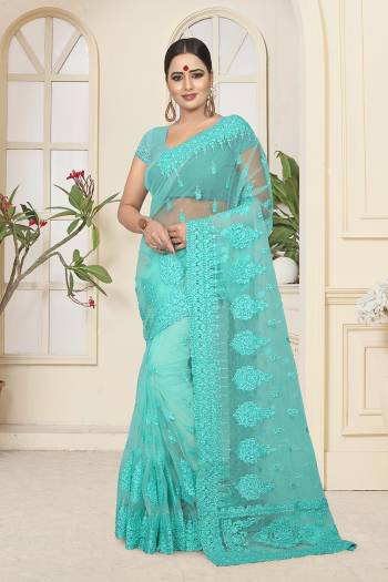 Bright And Appealing Color Is Here With This Heavy Designer Saree?In Turquoise Blue Color. This Saree and Blouse are Fabricated On Net Beautified With Tone To Tone Resham Embroidery And Ceramic Stone Work. It Is Easy To Drape And Carry Throughout The Gala.