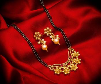 Grab This Heavy Double Chained Magalsutra Set Which Has A Heavy Designer Attatched Pendant With A Pair Of Earrings. This Mangalsutra Can Be Paired With Any Colored Traditional Attire And Suitable For Occasion Wear. Buy Now