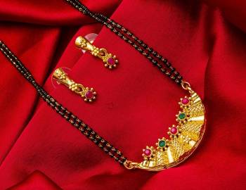 Grab This Heavy Double Chained Magalsutra Set Which Has A Heavy Designer Attatched Pendant With A Pair Of Earrings. This Mangalsutra Can Be Paired With Any Colored Traditional Attire And Suitable For Occasion Wear. Buy Now