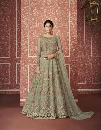 Catch All The Limelight This Wedding Season Wearing This Heavy Designer Floor Length Suit In Pastel Green Colored Top, Bottom And Dupatta. Its Heavy Embroidered Top Is Fabricated On Net Paired With Satin Bottom and Net Fabricated Dupatta. Its Pretty Embroidery Gives A Heavy And Subtle Look Both At The Same Time. Buy Now.