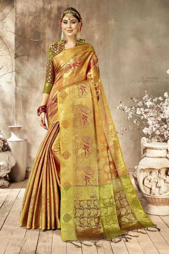 Add This Very Pretty Silk Based Saree To Your Wardrobe With Golden Highlight. This Saree Is Fabricated On Art Silk Paired With Art Silk Fabricated Blouse. It Is Beautified With Heavy Weave All Over It.