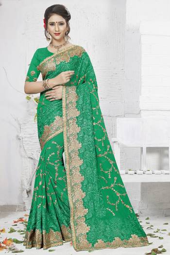 Celebrate This Festive And Wedding Season Wearing This Heavy Designer Saree In Green Color. This Saree Is Georgette Based With Heavy Embroidery Work Paired With Art Silk Fabricated Blouse. 