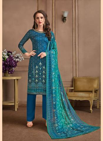 Grab This Pretty Suit In All Over Blue Color. Its Printed Top Is Satin Georgette Based Paired With Crepe Bottom And Georgette Fabricated Dupatta. It Is Beautified With Prints And Embroidery. Buy Now.