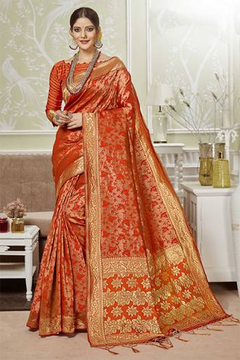 For A Proper Traditional Look, Grab This Silk Based Saree In Orange Color. This Saree And Blouse Are Fabricated On Banarasi Art Silk Beautified With Small Motif Weave All Over?