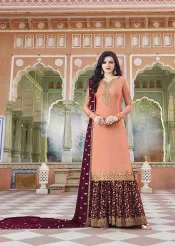 Pretty Unique Combination Is Here With This Heavy Designer Plazzo Suit In Peach Colored Top Paired With Contrasting Maroon Colored Bottom And Dupatta. Its Top And Bottom Are Fabricated On Satin Paired With Georgette Fabricated Dupatta. Buy Now.