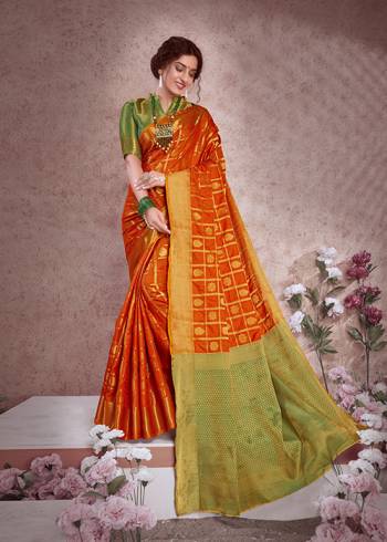 Enhance Your Personality In This Lovely Silk Based Designer Saree In Orange Color Paired With Contrasting Green Colored Blouse. This Saree And Blouse Are Fabricated On Banarasi Art Silk Which Gives A Rich Look To Your Personality. 