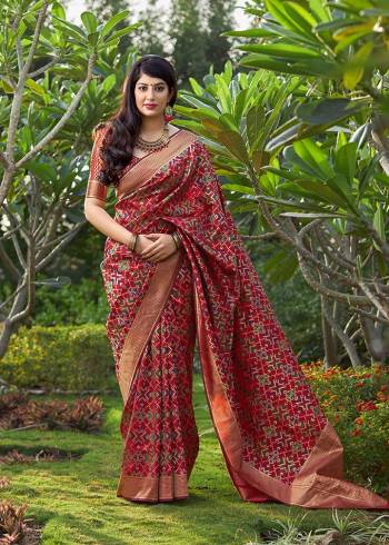 Add This Beautiful Saree To Your Wardrobe In Red Color Paired With Red Colored Blouse. This Saree And Blouse Are Fabricated On Banarasi Art Silk Beautified With Weave All Over. It Is Light Weight And Easy To Drape. 