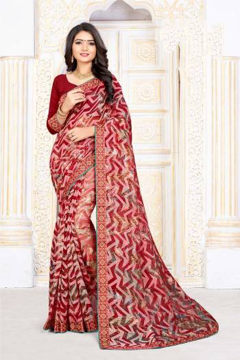 For Your Semi-Casuals, Grab This Pretty Printed Saree In Red Color Paired With Red Colored Blouse. This Saree Is Fabricated On Chiffon Brasso Paired With Art Silk Fabricated Blouse. It Is Light Weight And Easy To Carry All Day Long. 