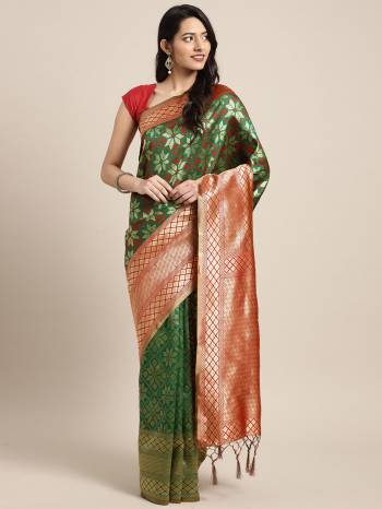 Celebrate This Festive Season In Traditional Look Wearing This Silk Based Saree In Dark Green Color. This Saree And Blouse are Fabricated On Art Silk Beautified With Weave All Over. 