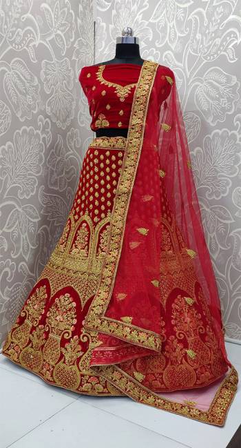 Get Ready For Your D-Day With This Heavy Designer Lehenga Choli In Red Color. This Lehenga Choli Is Velvet Based Paired With Net Fabricated Dupatta. Its Pretty Embroidery And Evergreen Red Color Will Definitely Earn You Lots Of Compliments From Onlookers.