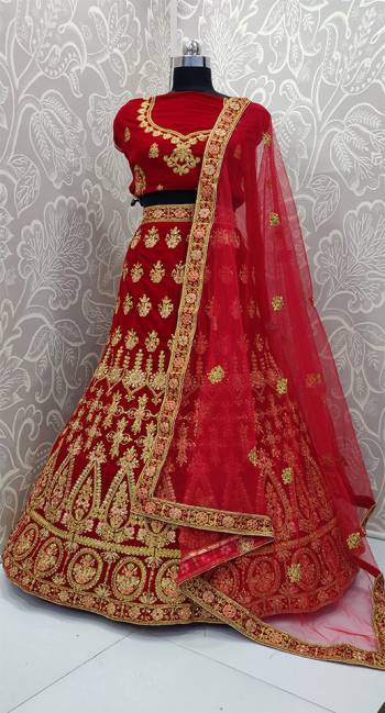 Get Ready For Your D-Day With This Heavy Designer Lehenga Choli In Red Color. This Lehenga Choli Is Velvet Based Paired With Net Fabricated Dupatta. Its Pretty Embroidery And Evergreen Red Color Will Definitely Earn You Lots Of Compliments From Onlookers.