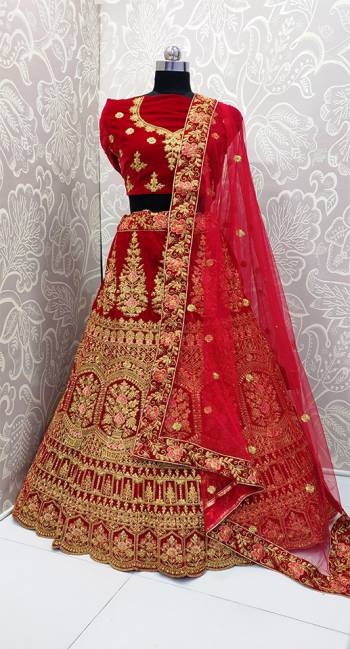 Get Ready For Your D-Day With This Heavy Designer Lehenga Choli In Red Color. This Lehenga Choli Is Velvet Based Paired With Net Fabricated Dupatta. Its Pretty Embroidery And Evergreen Red Color Will Definitely Earn You Lots Of Compliments From Onlookers.