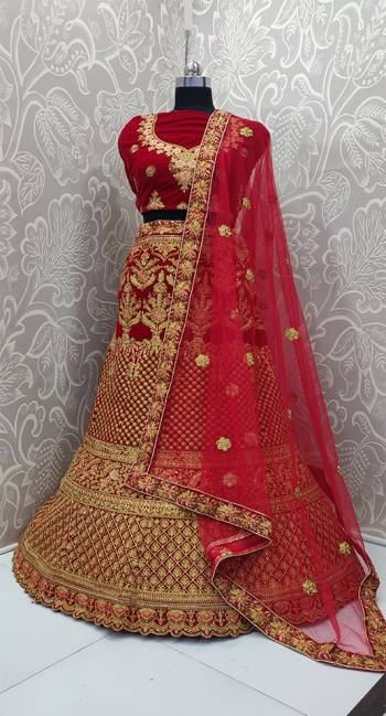 Get Ready For Your D-Day With This Heavy Designer Lehenga Choli In Red Color. This Lehenga Choli Is Velvet Based Paired With Net Fabricated Dupatta. Its Pretty Embroidery And Evergreen Red Color Will Definitely Earn You Lots Of Compliments From Onlookers.