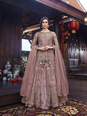 Look Pretty In This Designer Indo Western Dress In All Over Onion Pink Color. Its Gown IS Fabricated On Satin Paired With Embroidered Net Fabricated Jacket With Santoon Bottom And Net Dupatta. 