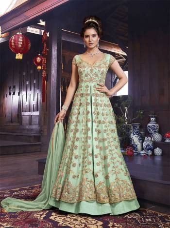 Grab This Very Beautiful And elegant Looking Designer Indo-Western Suit In Light Green Color Which Comes With A Lehenga And Embroidered Pants. Its Heavy Embroidered Top IS Net Based Paired With Art Silk Fabricated Both Bottom And Net Fabricated Dupatta. 