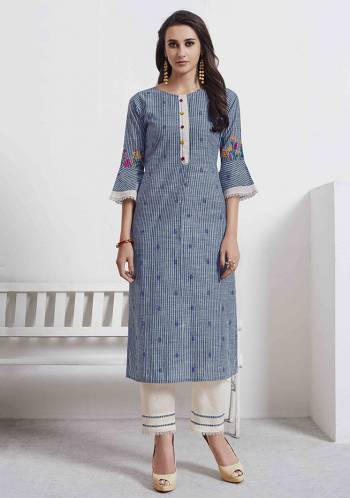 Grab This Very Pretty Pair Of Readymade Kurti And Pant. This Pretty Kurti Is In Blue Color Paired With Off-White Colored Bottom. Its Top And Bottom Are Cotton Based Beautified With Thread Work. 