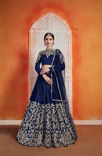 Enhance Your Personality In Traditionals Wearing This Heavy Designer Lehenga Choli In All Over Navy Blue Color. This Heavy Embroidered Lehenga Choli IS Fabricated On Art Silk Paired With Net Fabricated Dupatta. Its Rich Color and Fabric Will Defenitely Earn You Lots Of Compliments From Onlookers. 